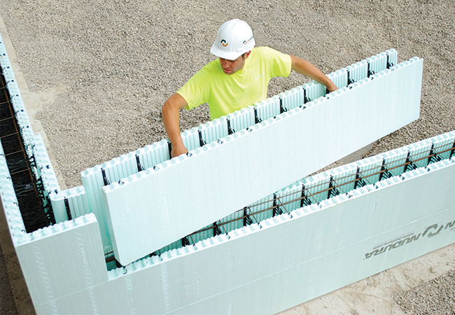 Nudura placing a strait layer of ICF